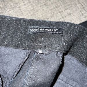 Woman’s black capris.